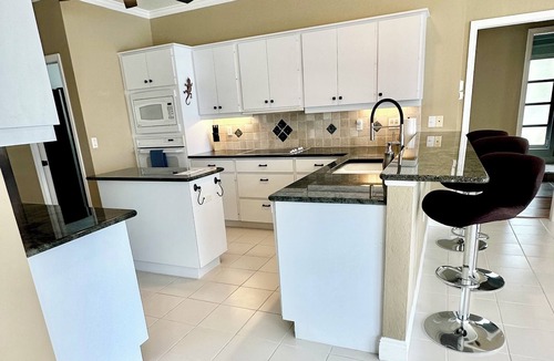 Burnt Store Isles House | INCREDIBLE WATER VIEW! NEW LUXURY REMODELED HOME; HEATED SALT POOL, GOLF NEARBY