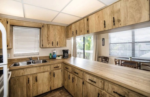 Indian Rocks Beach Apartment | Just 1 block from the sugar white sand beach. Charming 2 bedroom Beach suite with large private deck . Walk To Restaurants, Shops And The Beach