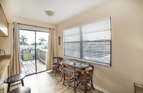 Indian Rocks Beach Apartment | Just 1 block from the sugar white sand beach. Charming 2 bedroom Beach suite with large private deck . Walk To Restaurants, Shops And The Beach