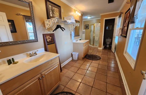 Lookout Valley Neighborhood Association Cabin | King Room with Sofa Bed and Balcony with River Views