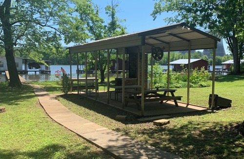 Fackler Apartment | Lake side apartment with shared 100’ pier and pavilion with rock BBQ pit.