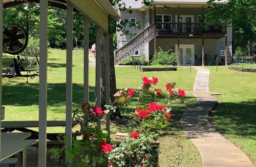 Fackler Apartment | Lake side apartment with shared 100’ pier and pavilion with rock BBQ pit.