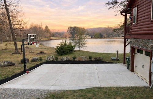 Mills River House | Lakefront cabin & tiny home with a firepit, wet bar, washer/dryer, dock