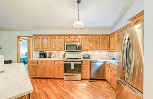 Livingston House | Lakefront home with deck, hot tub, game room, kayaks, & fireplace