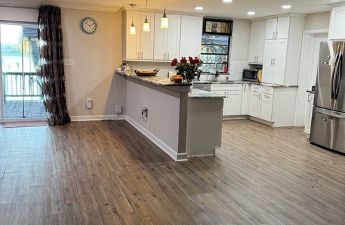 Eustis House | Lakefront Paradise Sauna Hot Tub Jet Skis Sunset Views