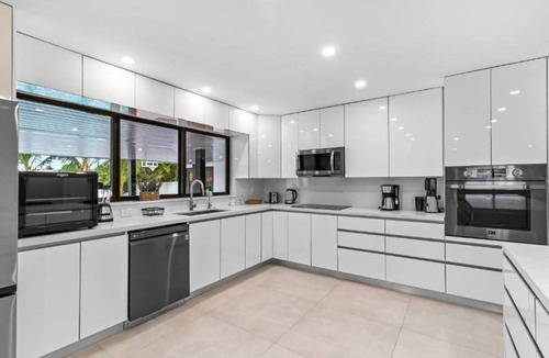 North Miami Beach Villa | Lakefront Tropical Villa by Glam Homes