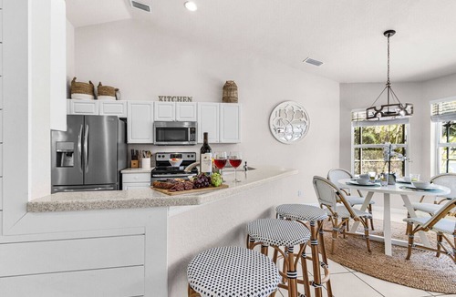Central Naples House | Lazy days & lake views. Beautiful Naples pool home in Briarwood