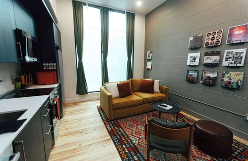 Central City Apartment | Loft 304 Thewilliam Earthy Modern Atrium Glow