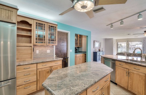 Yacht Club House | Lovely Canal Home in SW Cape with heated pool, game room, and a tiki on the dock