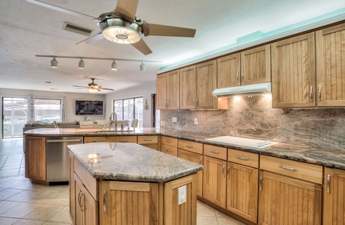 Yacht Club House | Lovely Canal Home in SW Cape with heated pool, game room, and a tiki on the dock