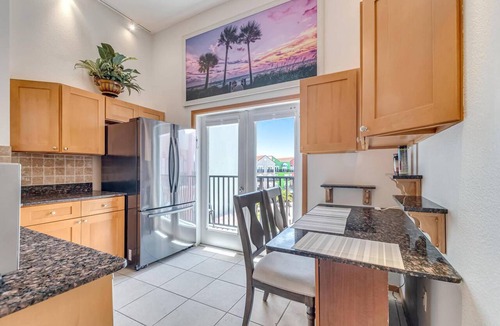 Palm Coast Condo | Lovely Oasis Condo | Balcony with Courtyard Views | European Village | Near Beaches & Dining