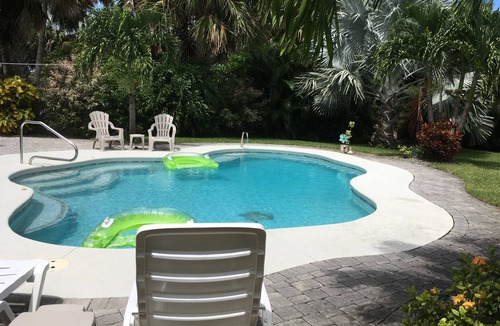 Melbourne Beach House | Lower RATES Private oasis pool &yard beach so close