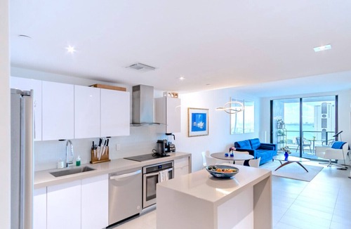 Town Square Condo | Lunabase ☾ Remote Life Dream | Smart Condo, Spacious Lounge Patio, Book Haven, Workspace, Parking