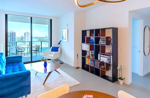 Town Square Condo | Lunabase ☾ Remote Life Dream | Smart Condo, Spacious Lounge Patio, Book Haven, Workspace, Parking