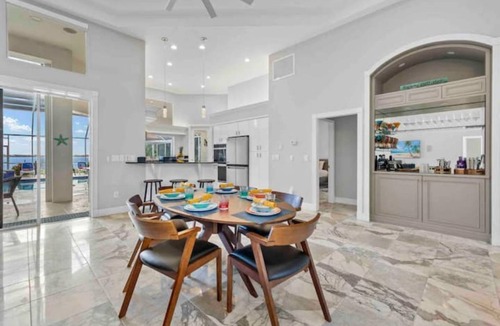 Yacht Club House | Lux Riverfront Retreat~Pool~Spa~Outdoor bar~Tropical Yard~Direct Gulf Access