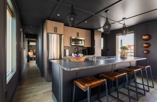 Inner Harbor Boat Rental | Luxe Black Houseboat: Inner Harbor Skyline Views