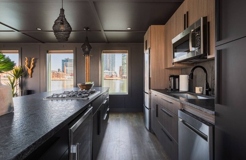 Inner Harbor Boat Rental | Luxe Black Houseboat: Inner Harbor Skyline Views