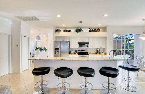 Central Naples House | Luxurious 4 bedroom 3 bath private pool home with gorgeous lake views!