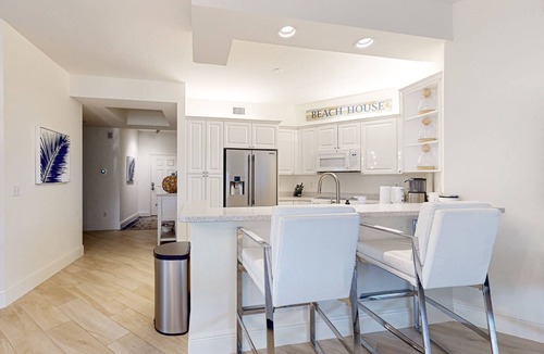 Vanderbilt Beach Condo | Luxurious condo with on-site pool, private extended balcony, & W/D