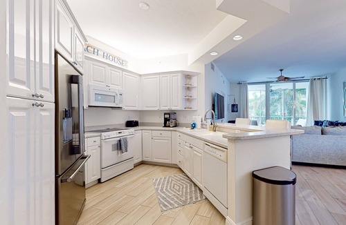 Vanderbilt Beach Condo | Luxurious condo with on-site pool, private extended balcony, & W/D