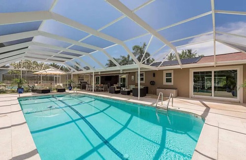 Isles of Capri House | Luxurious Waterfront Retreat! Oversized Heated Pool and expansive outdoor area!
