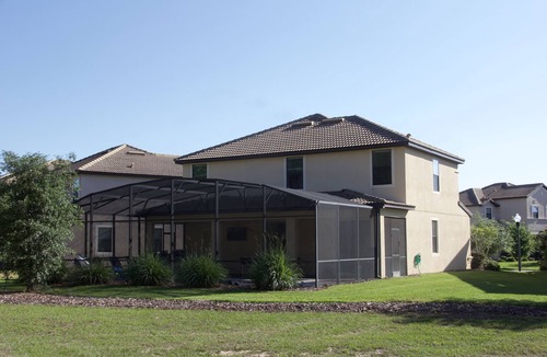 Davenport Villa | Luxury 5 bed; outside BBQ/TV area with South facing pool