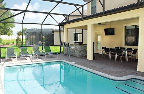 Davenport Villa | Luxury 5 bed; outside BBQ/TV area with South facing pool