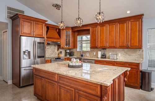 Dunedin House | Luxury 5 Bedroom Dunedin home ~ TWO full kitchens, heated pool, hot tub!