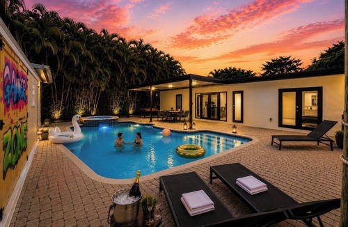 Hialeah House | Luxury 6BR Oasis w/Pool, Fire Pit & Game Area Sleeps 18