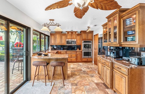 Cocoa Isles House | Luxury Canalfront Home w/Heated Pool, Game Room, Boat & Jet Ski Lifts