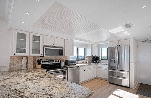 New Smyrna Beach Condo | Luxury, direct oceanfront top-floor corner with wrap-around balcony and heated pool