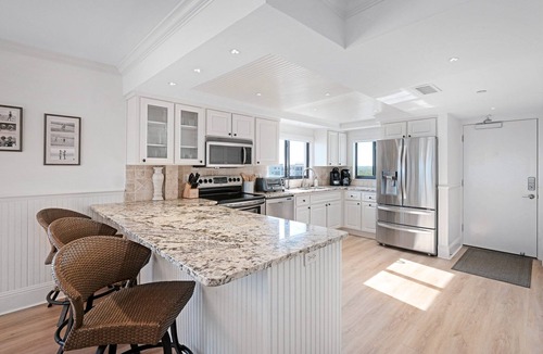 New Smyrna Beach Condo | Luxury, direct oceanfront top-floor corner with wrap-around balcony and heated pool