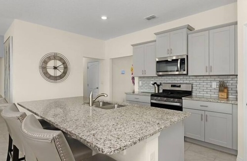 Sunridge Woods Villa | Luxury Family Villa with Themed Rooms, Pool, Spa & Games Room Near Disney