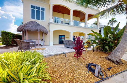 Siesta Isle House | Luxury home boasting waterfront views with pool and golf simulator