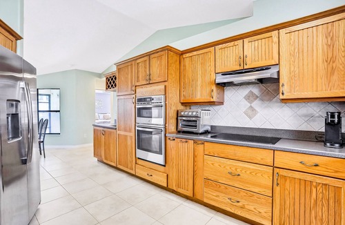 Marineland Acres House | Luxury home with a pool, enclosed yard, grill, washer/dryer & central AC