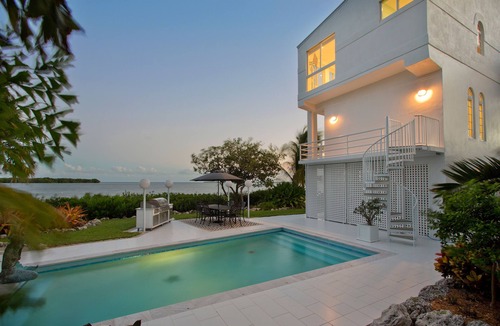 Cutthroat Harbor Estates House | Luxury * Panoramic Oceanfront Views * Boat Dock * Heated Pool