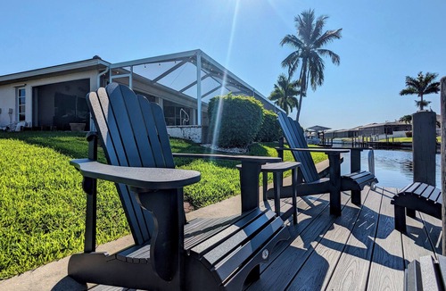 Cape Coral House | Luxury south facing waterfront home with heated salt pool and spa!