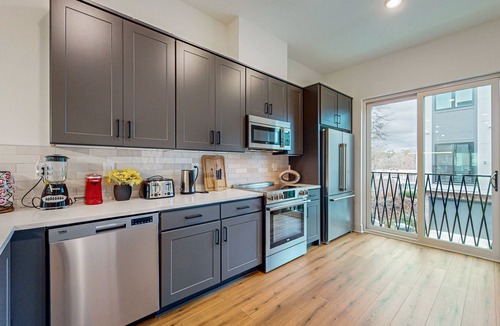 Lindridge-Martin Manor House | Luxury townhome with open-concept living space & gas fireplace