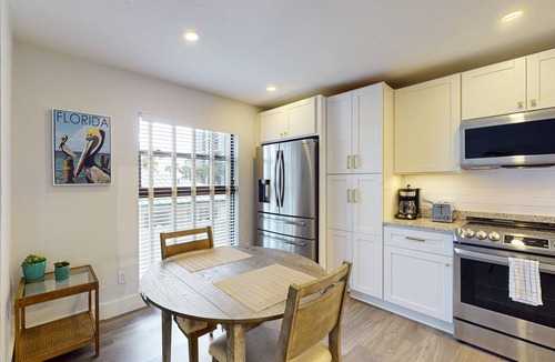 Marco Island Condo | Luxury waterfront condo with shared pool, hot tub, and a tennis court