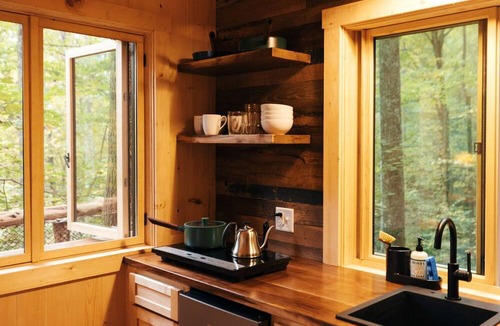 Zirconia Cabin | Magical Treehouse Stay with Creekside Sauna Experience in Zirconia, North Carolina