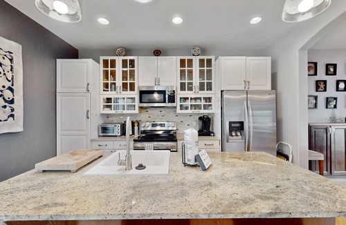 New Smyrna Beach House | Manicured home & pool house w/private pool - short walk to the ocean