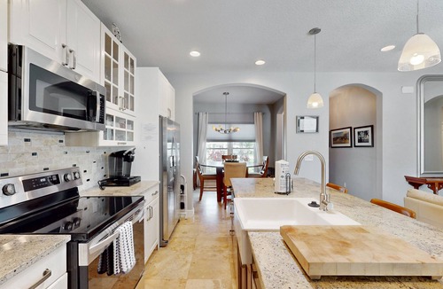 New Smyrna Beach House | Manicured home & pool house w/private pool - short walk to the ocean