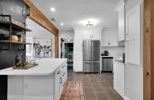 Lakewood House | Mid-Century Boho Chic home with Pool, Game Room & Outdoor Playhouse.