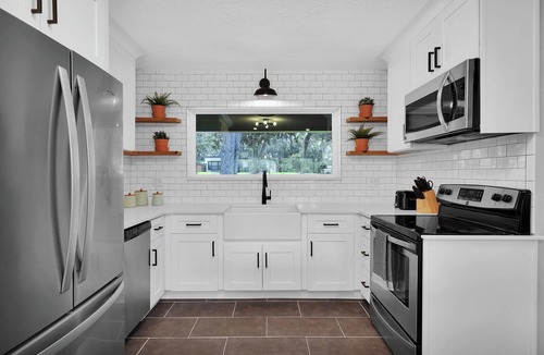Lakewood House | Mid-Century Boho Chic home with Pool, Game Room & Outdoor Playhouse.