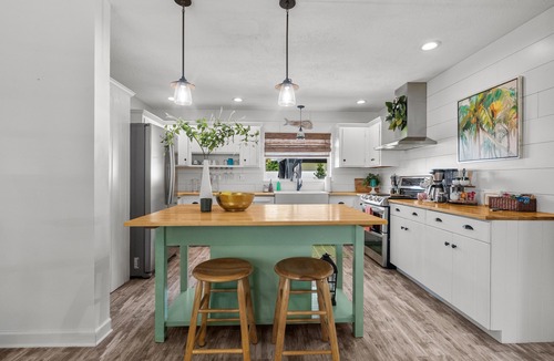 Stuart House | Modern coastal getaway with hot tub, putting green and private backyard oasis.