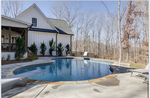 Franklin House | Modern farmhouse on 24 acres of trees with a heated pool