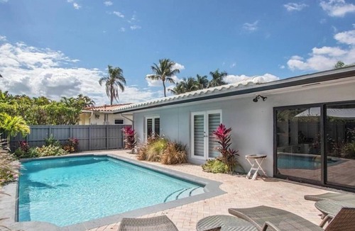 Dolphin Isles House | MODERN LUXURY: 4 Bedroom Heated Pool Home! Walk to beach & Restaurants!