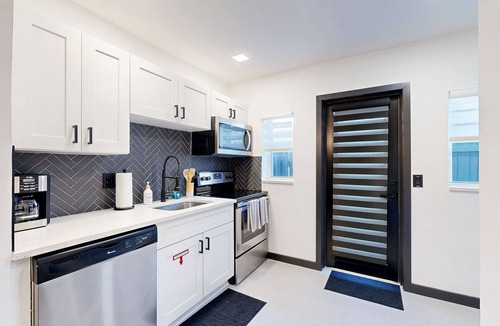 Poinsettia Heights House | Modern smart-home villa w/private backyard & fully equipped kitchen