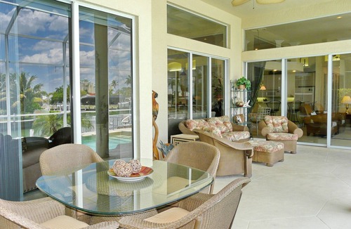 Marco Island House | Modern waterfront home with pool/view of waterways