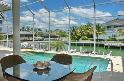 Marco Island House | Modern waterfront home with pool/view of waterways